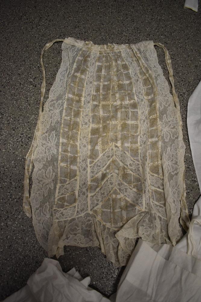 A large collection of Victorian to early 20th century petticoats and aprons, many with intricate - Image 8 of 12