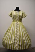 A 1950s polished cotton day dress, having pistachio green and white striped pattern, with tie