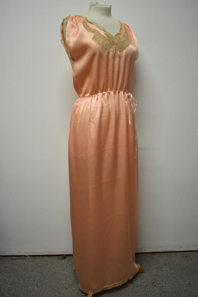 A 1920s pale pink silky 1920s nightdress, having adjustable ribbon fastening to waist, pretty lace - Image 6 of 14