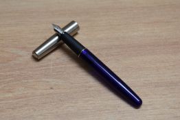 A Parker Frontier cartridge fountain pen in translucent blue with stainless steel cap and Parker