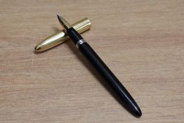 A Sheaffer Crest snorkel fill fountain pen in black with white spot gold fill cap having Sheaffer