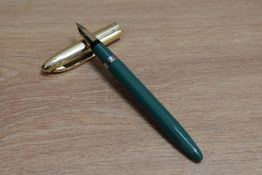 A Sheaffer Statesman snorkel fill founatin pen in fern green with white spot gold cap having