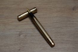 A Mabie Todd & Co Swan leverless twist fill fountain pen in engine turned 9ct gold having Swan 2H