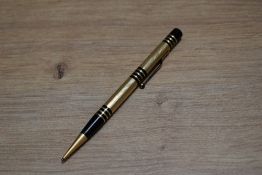 A Mabie Todd & Co Fyne Poynt propelling pencil set in black with gold overlay and several decorative