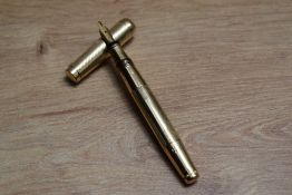A Mabie Todd & Co Swan twist fill fountain pen in yellow metal with engine turned decal having