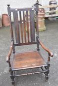 A 19th Century oak carver chair having rail back and solid seat, width approx 62cm