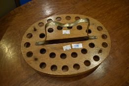 A traditional oak stand for communion or similar glasses