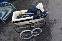 A vintage Silver Cross dolls pram