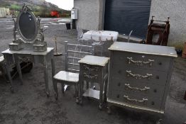 A silver painted bedroom suite and complimentary electric towel rail