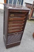 A vintage office cabinet having tambour top, stamped Wolfe