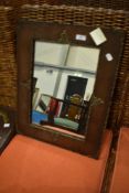 A vintage oak ply mirror with foliate applique decoration