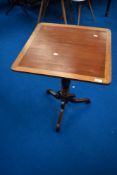 A 19th Century mahogany occasional table having turned column and triple splay supports