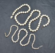 Two strings of cultured pearls comprising a graduated string having a pinkish-white lustre with a