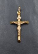A 9ct gold crucifix pendant, approx 35mm long, 40mm with loop and 1.6g