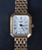 A ladies 9ct gold wrist watch by Longines, the white dial with Roman numerals, having a personalised