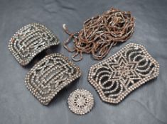 A small selection of cut steel including belt buckle, shoe buckles, button and chain