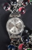 A Swatch watch no:#814 having Arabic numeral and dot dial to silvered face and chain bracelet with