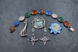 A small selection of silver jewellery including two enamelled brooches, cat brooch amethyst style