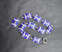 A Scandinavian silver and enamel ten panel bracelet, (one panel loose) having blue and cream