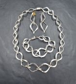 A suite of silver jewellery stamped TM-60 of linked open leaf form with box clasps, comprising