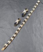 A diamond and sapphire bracelet having sixteen oval sapphires interspersed by diamond chip set