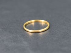 A 22ct gold wedding band, ring size K and approx 1.2g