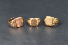 Three 9ct gold and yellow metal signet rings all of worn conditiion, one having a split loop and