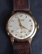 A vintage nine carat gold cased Accurist wristwatch, the champagne dial with alternating Arabic