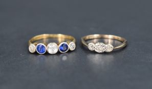 Two ladies yellow metal dress rings of worn condition, one having a trio of diamond chips, the other
