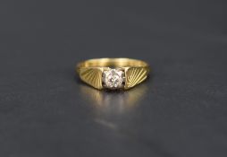 A diamond solitaire ring, the diamond set in an illusion setting with graduated line engraved