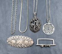 A collection of silver and white metal jewellery including a marcasite set floral motif pendant on a