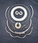 A silver three piece suite of jewellery of modernist form having gilt dot and diamond chip