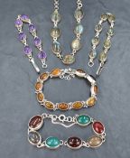 A small selection of silver jewellery having polished stones, including matching necklace and