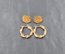Two pairs of 9ct gold earrings, one of twist loop form the other of decorative disc form, approx 3.