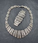 A silver necklace and matching bracelet of multi bar form, both having hook and loop clasps,