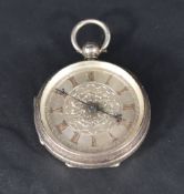A small Victorian key wound silver pocket watch having Roman numeral dial to decorative silvered
