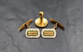 A pair of yellow metal and enamel cufflinks stamped 22C having green and white detail to front panel