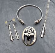 A set of silver jewellery by Kit Heath comprising pendant, earrings and bangle, all having jet