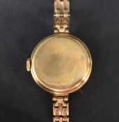A lady's 9ct gold wrist watch by Avia having Arabic and baton numeral dial with subsidiary seconds