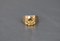 A peridot style single stone solitaire ring, approx 3ct in a 4 claw set open mount on a heavy 9ct