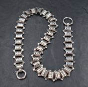 A Victorian white metal chain having pierced brick links and a double clasp, approx 18' & 39.7g