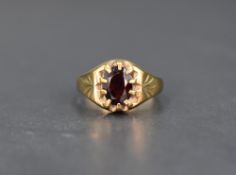 A gent's 9ct gold signet ring having a gypsy set oval garnet, size S & 5.8g