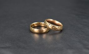 Two 9ct gold wedding bands, one having engraved decoration, sizes M & Q and approx 9.4g total