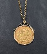 A gold half sovereign dated 1909 in a 9ct gold removable decorative pendant mount on a 9ct gold