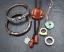 A small selection of costume jewellery including two Oriental silver and wood bangles, one having
