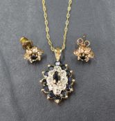 A diamond and sapphire oval cluster pendant set in gold plated silver mount and chain with a pair of
