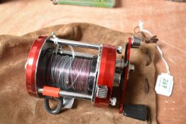An Abu Ambassadeur 7000 sea fishing reel in suede pouch (very clean)