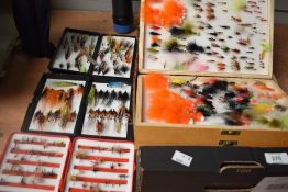 A wooden 2 sided fly box along with 2 Hardy pocket boxes and 2 other pocket boxes containing a