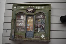 A wooden diorama depicting a vintage fishing tackle shop
