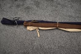 Two vintage fishing rods and a tail snare for landing, one wooden handled and fibreglass beech
